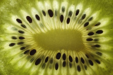 Photo of Tasty kiwi with seeds as background, macro