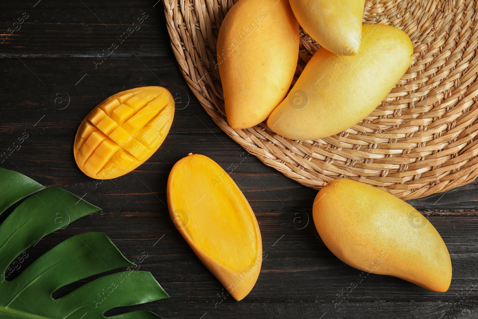 Photo of Flat lay composition with mango on wooden background