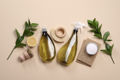 Photo of Flat lay composition with different cleaning supplies on beige background