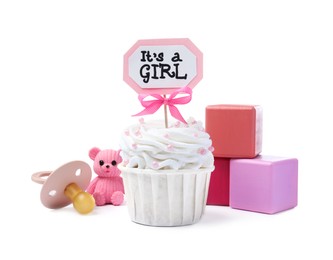 Photo of Beautifully decorated baby shower cupcake for girl and toys on white background