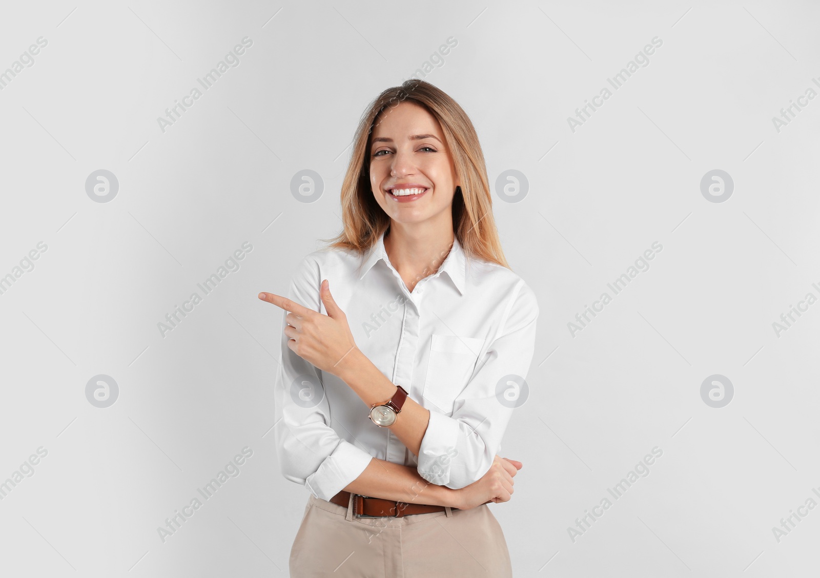 Photo of Portrait of beautiful young businesswoman on white background