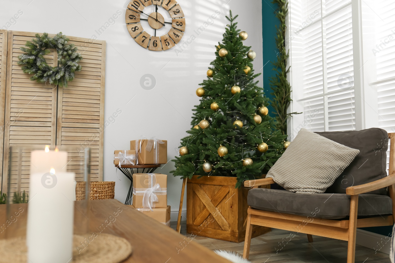 Photo of Beautiful decorated Christmas tree in living room interior