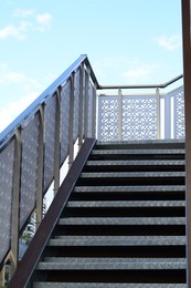 Photo of View of metal outdoor stairs with railing