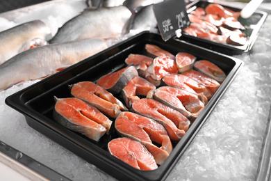 Steaks of fresh fish on ice in supermarket
