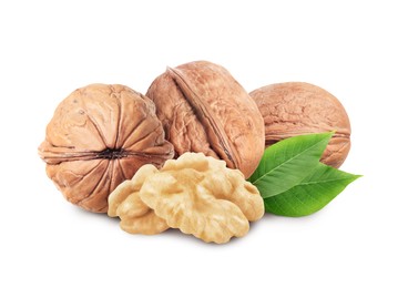 Image of Tasty walnuts and green leaves on white background