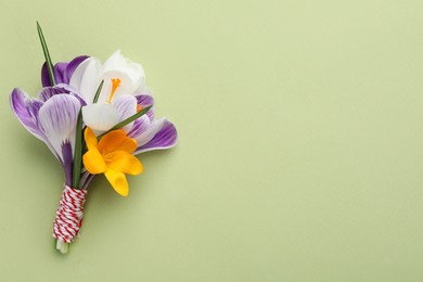 Photo of Beautiful crocus bouquet on beige background, top view. Space for text