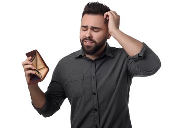 Photo of Upset man showing empty wallet on white background