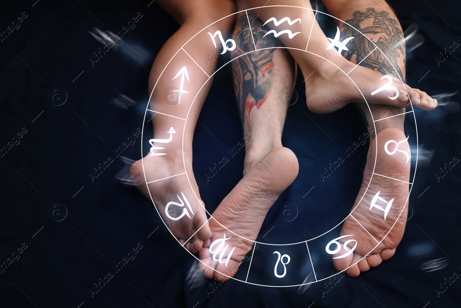 Image of Sexual compatibility. Zodiac wheel and passionate couple having sex on bed, closeup of legs