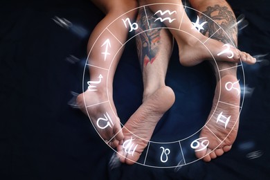 Sexual compatibility. Zodiac wheel and passionate couple having sex on bed, closeup of legs