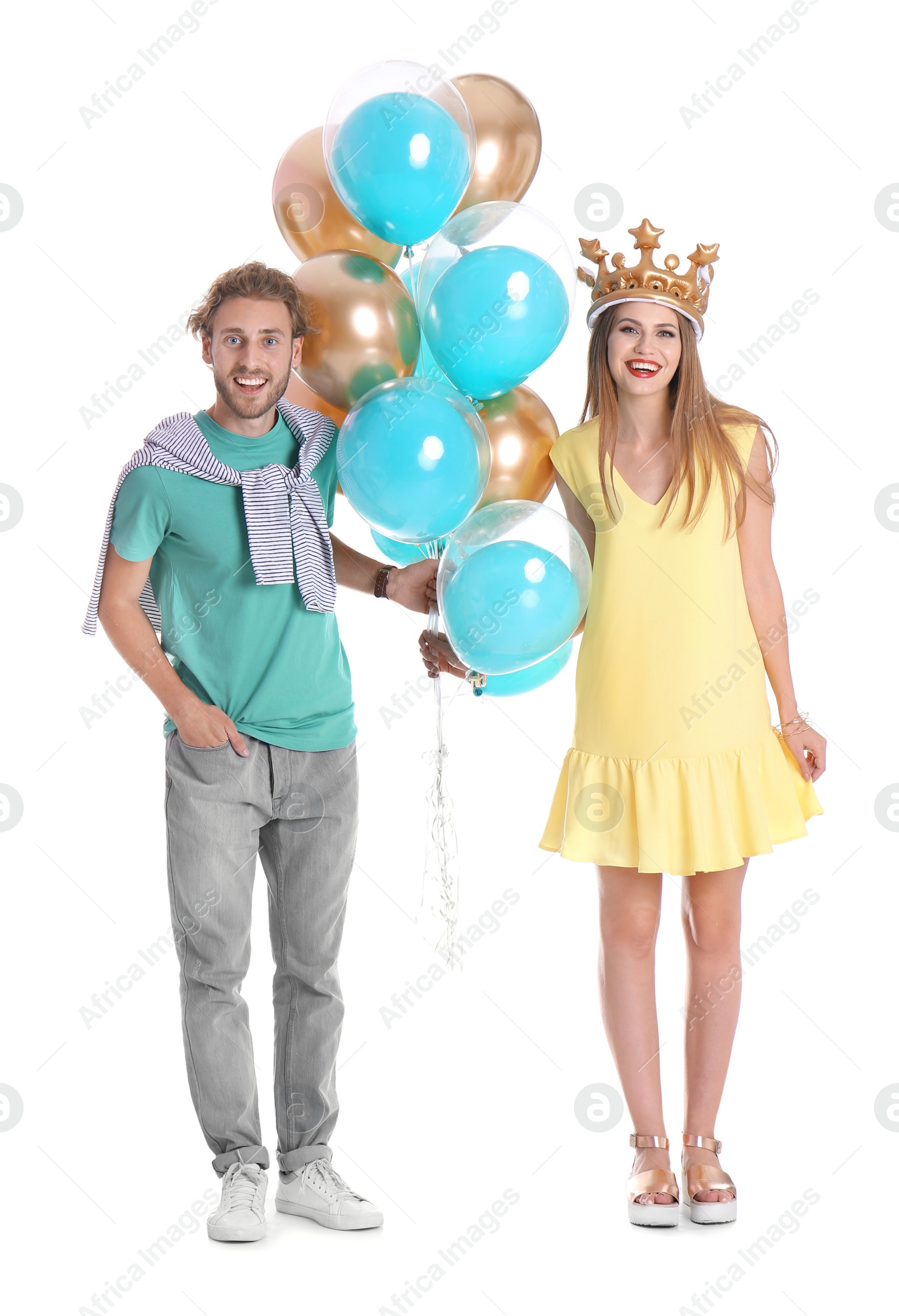 Photo of Young couple with air balloons on white background