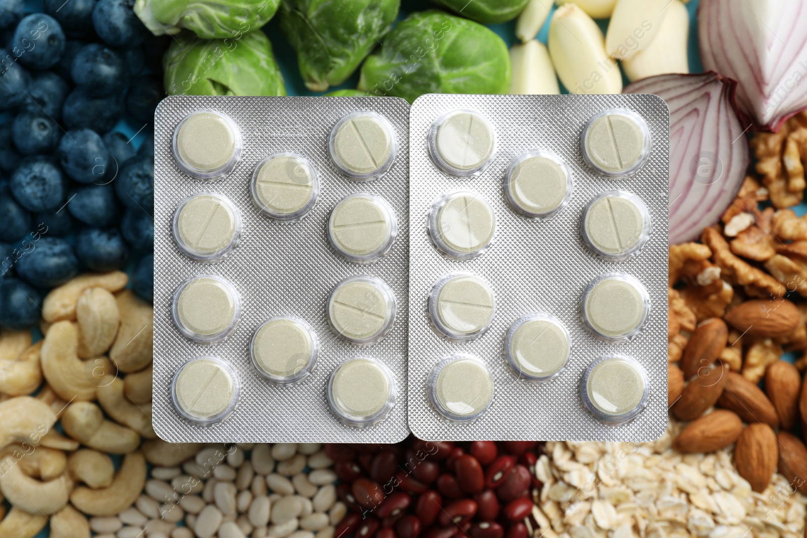 Photo of Blisters of pills on foodstuff, top view. Prebiotic supplements