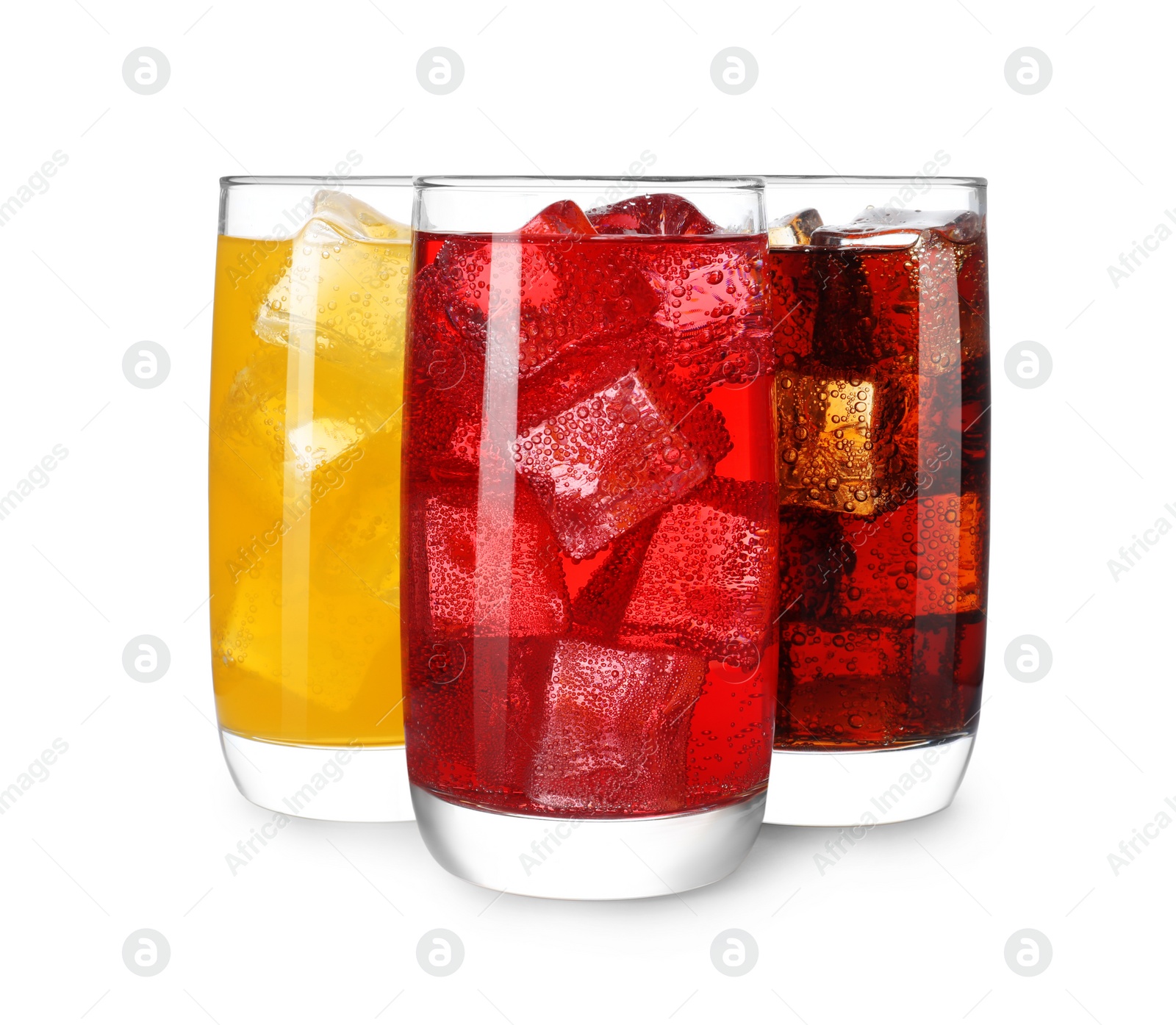 Photo of Glasses of different refreshing soda water with ice cubes isolated on white