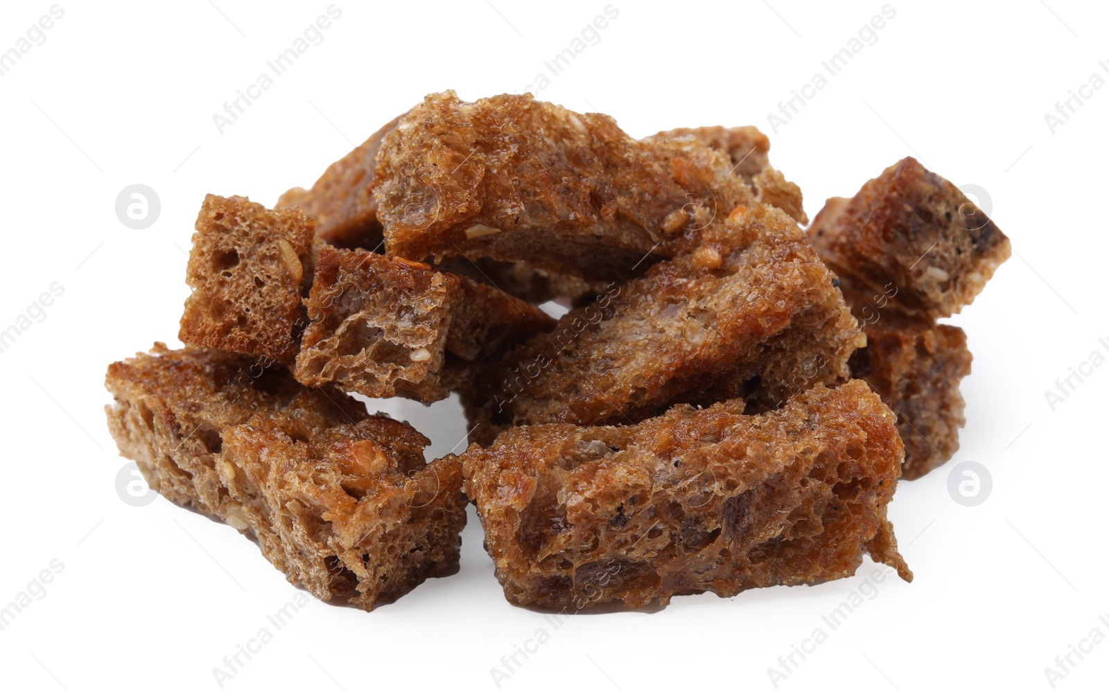 Photo of Pile of delicious crispy rusks on white background