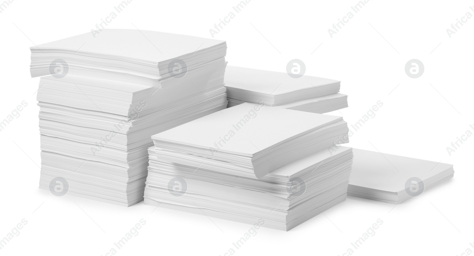 Photo of Stacks of paper sheets on white background