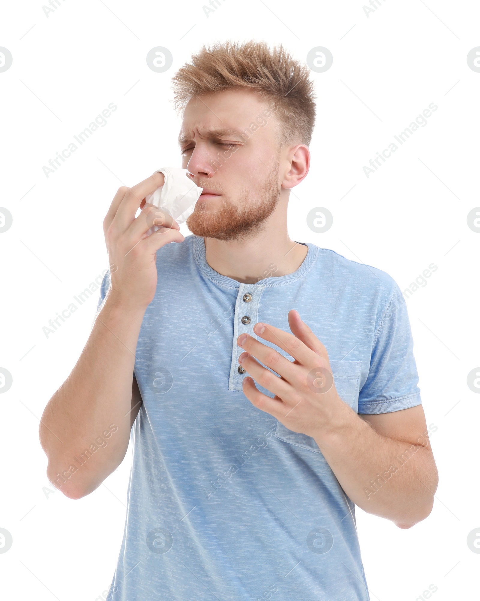 Photo of Young man suffering from allergy on white background