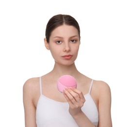 Photo of Washing face. Young woman with cleansing brush on white background