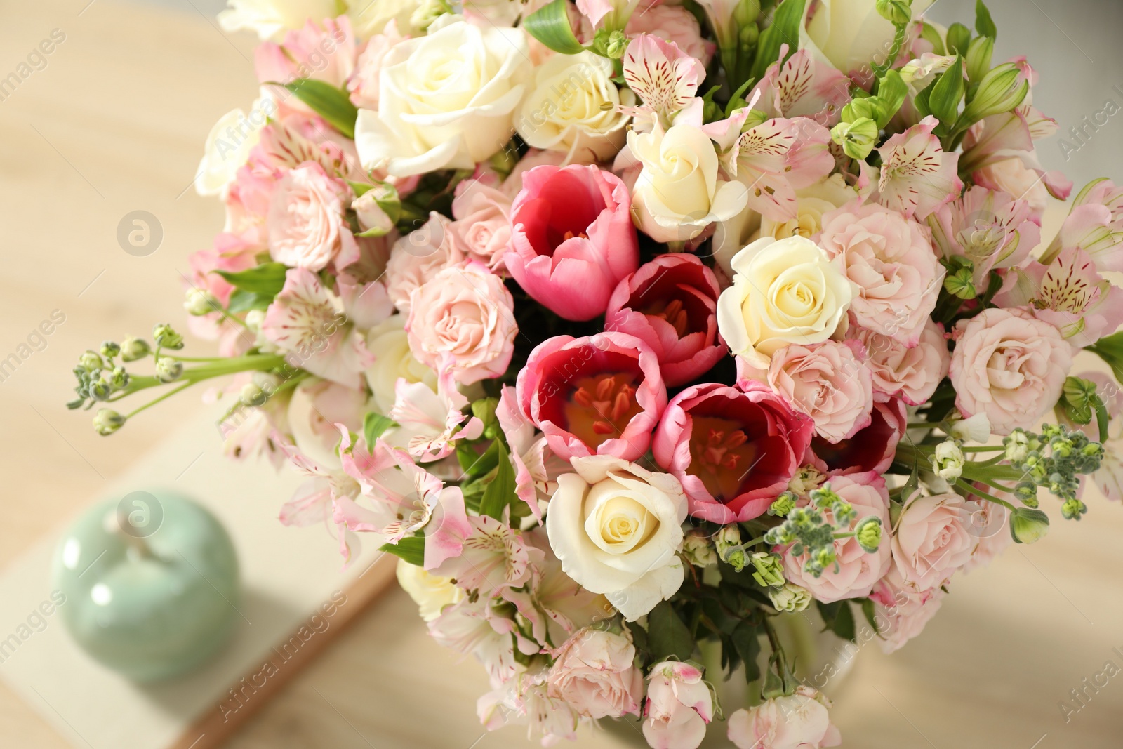 Photo of Beautiful bouquet of fresh flowers on table indoors, closeup