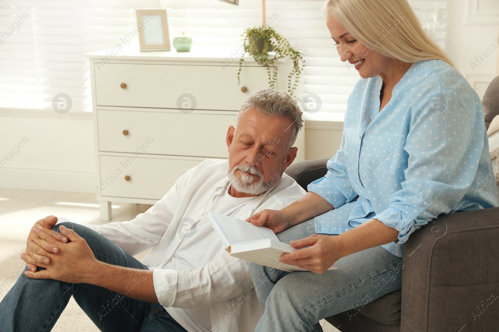 Photo of Happy senior couple spending time together at home