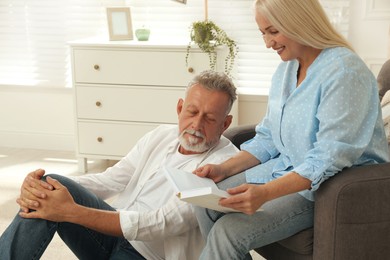 Happy senior couple spending time together at home