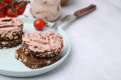 Photo of Delicious liverwurst sandwiches served on white table, closeup. Space for text