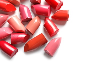 Photo of Collection of lipsticks on white background, top view