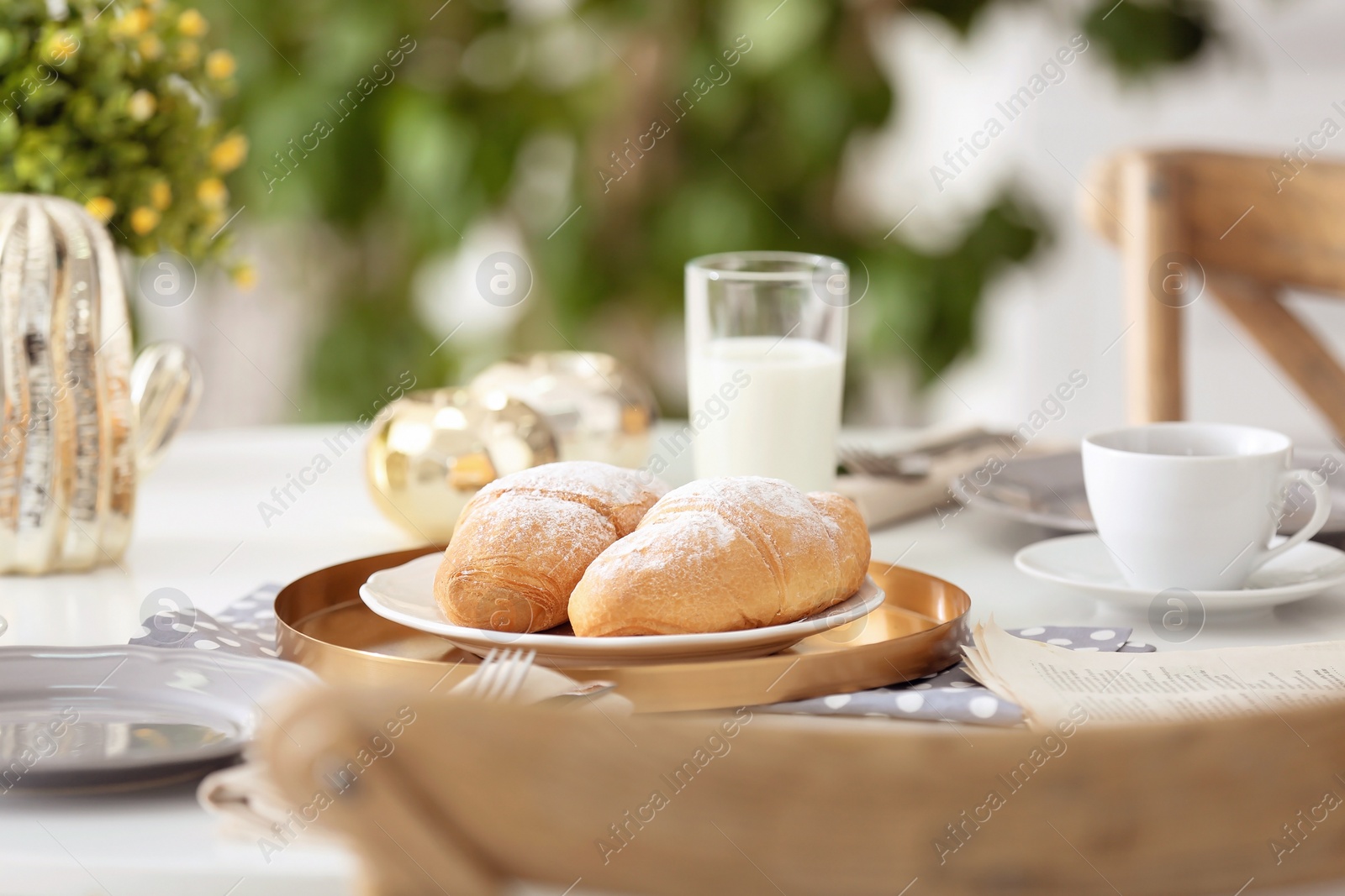 Photo of Tasty breakfast with fresh croissants on table