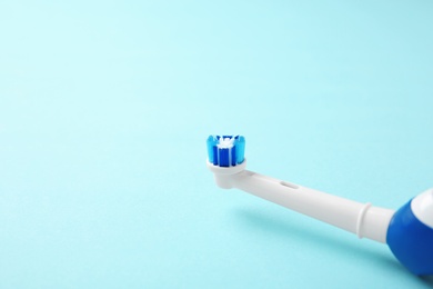 Photo of Electric toothbrush on color background. Dental care