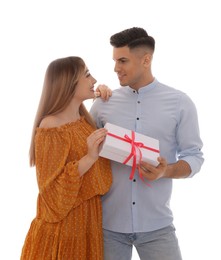 Photo of Lovely couple with gift box on white background. Valentine's day celebration