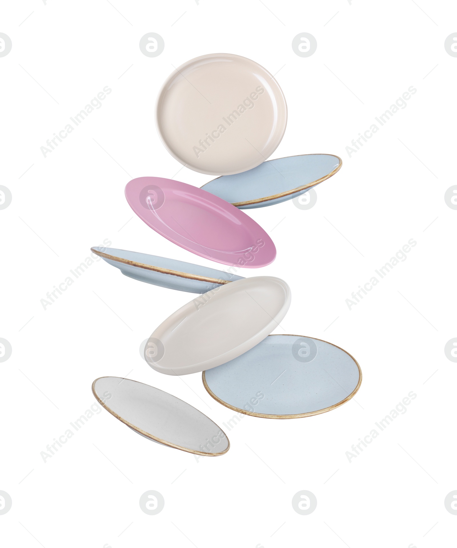 Image of Many different plates falling on white background