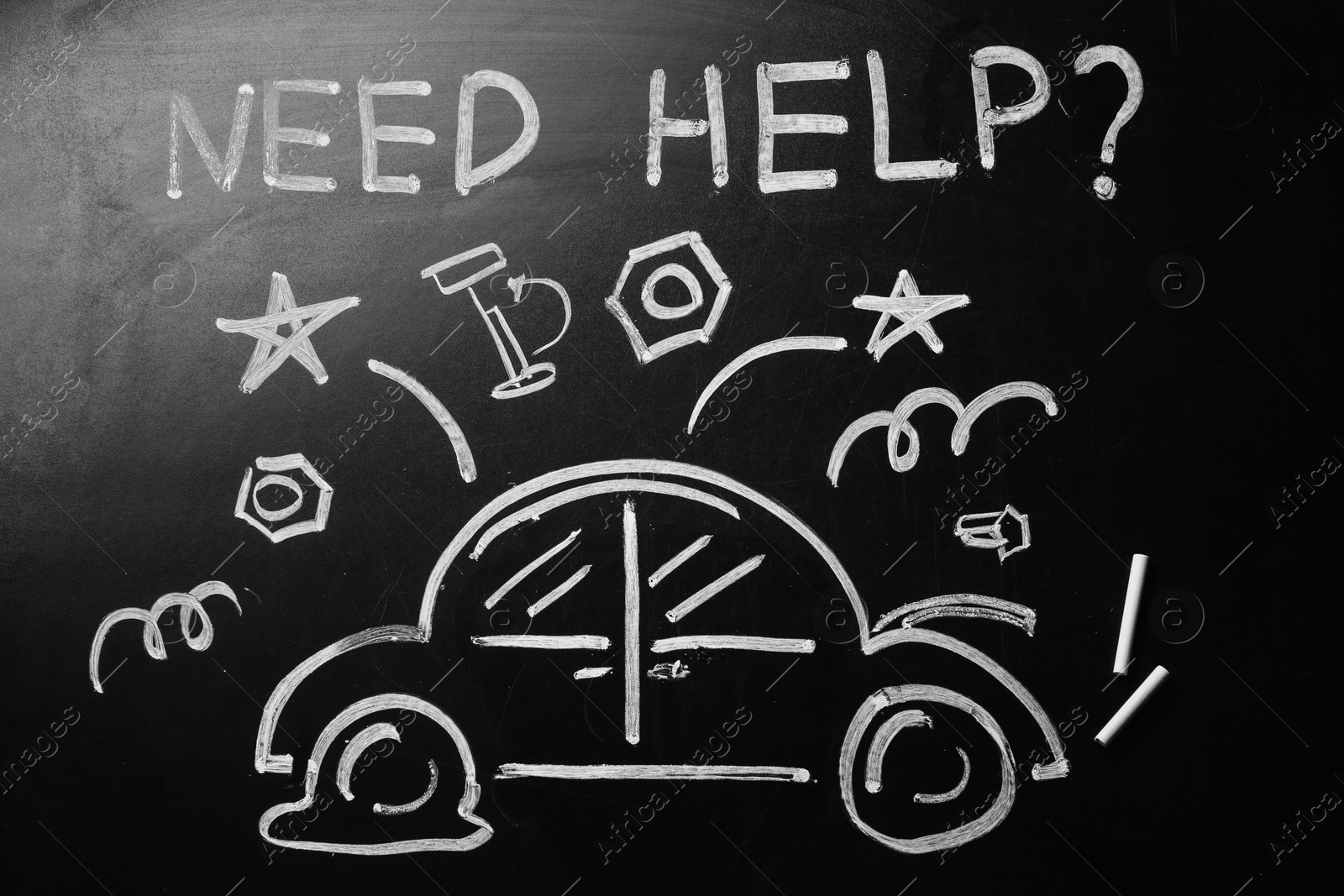 Photo of Drawing of broken car and phrase "NEED HELP?" on chalkboard