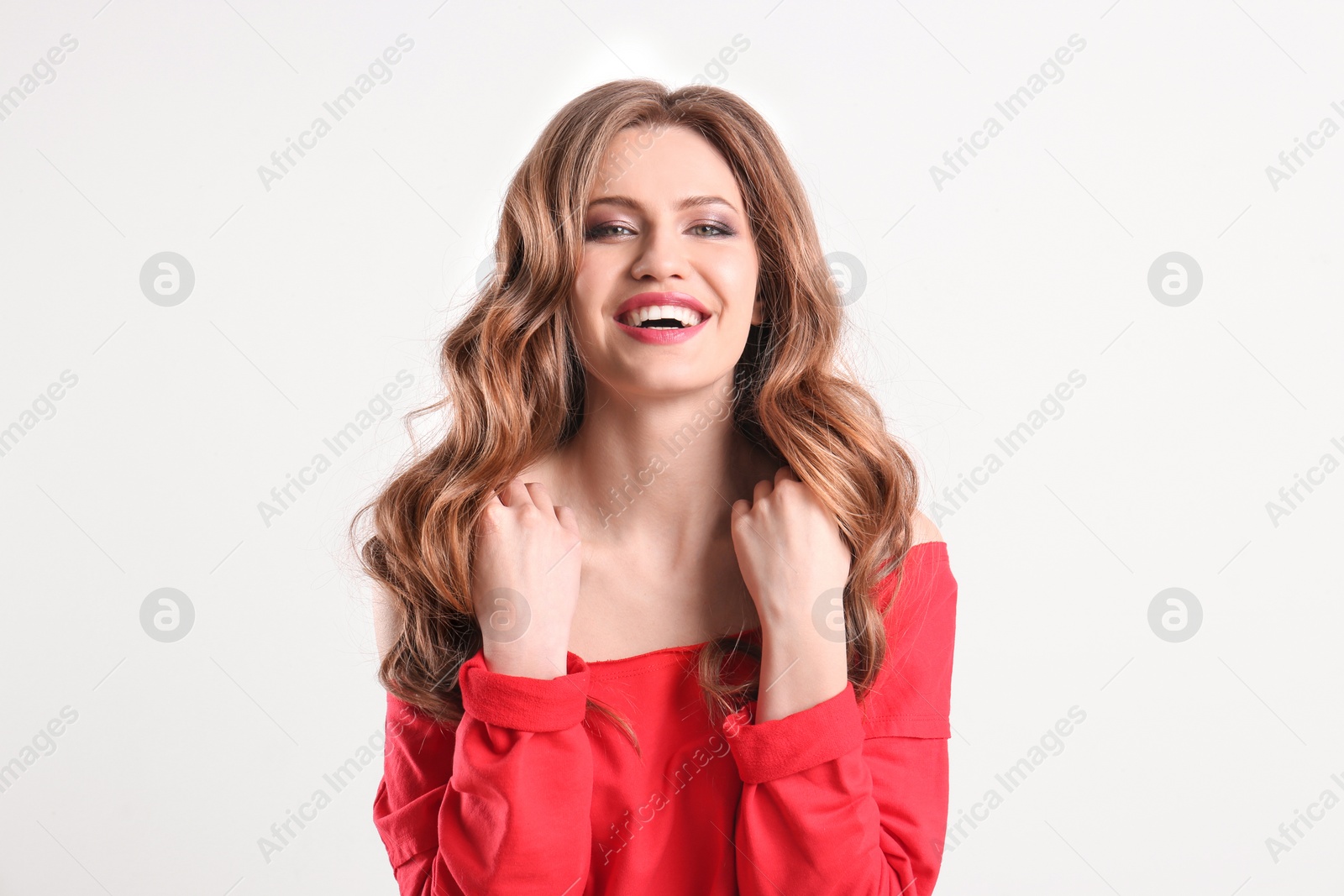 Photo of Portrait of young woman with long beautiful hair on white background