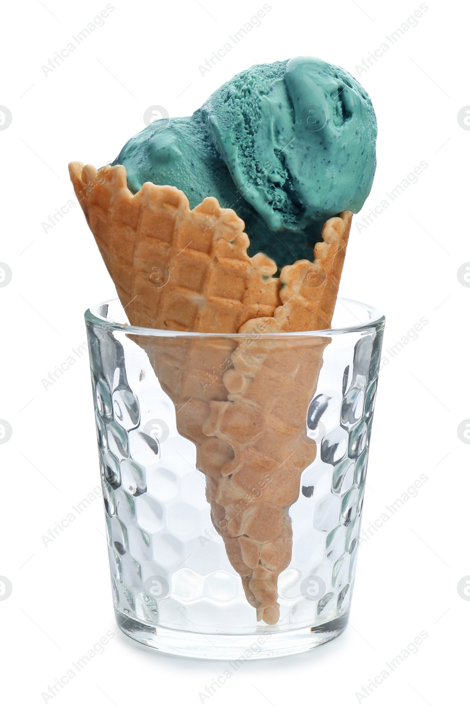 Photo of Spirulina ice cream cone in glass on white background