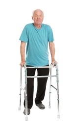 Full length portrait of elderly man using walking frame isolated on white