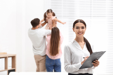 Photo of Professional psychologist and happy family in office