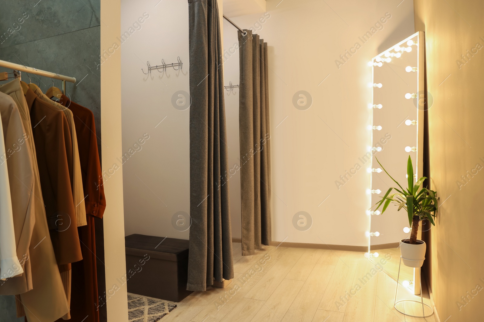 Photo of Dressing rooms in fashion store. Interior design