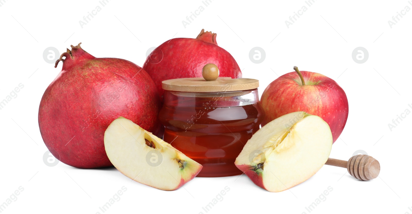 Photo of Honey, apple and pomegranates on white background. Rosh Hashanah holiday