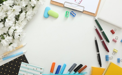 Photo of Frame made of flowers and stationery on white background, flat lay with space for text. Teacher's Day