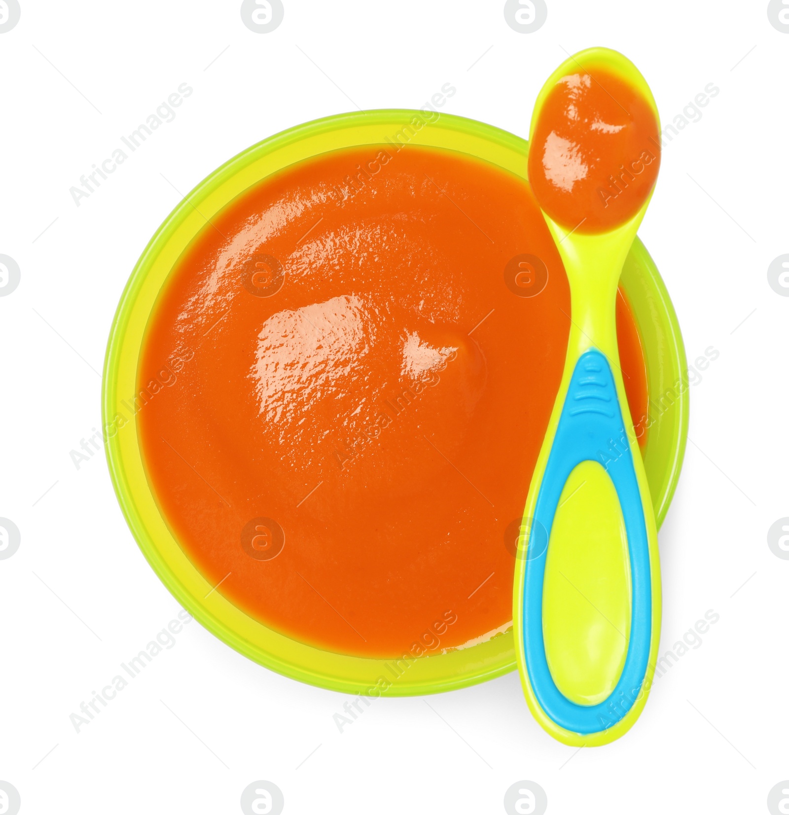 Photo of Delicious baby food in bowl and spoon isolated on white, top view