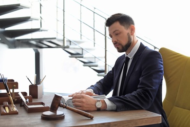 Photo of Male lawyer working in office