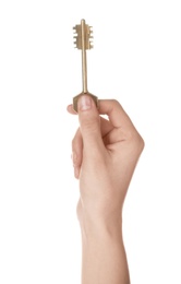 Photo of Woman holding bronze vintage ornate key on white background, closeup