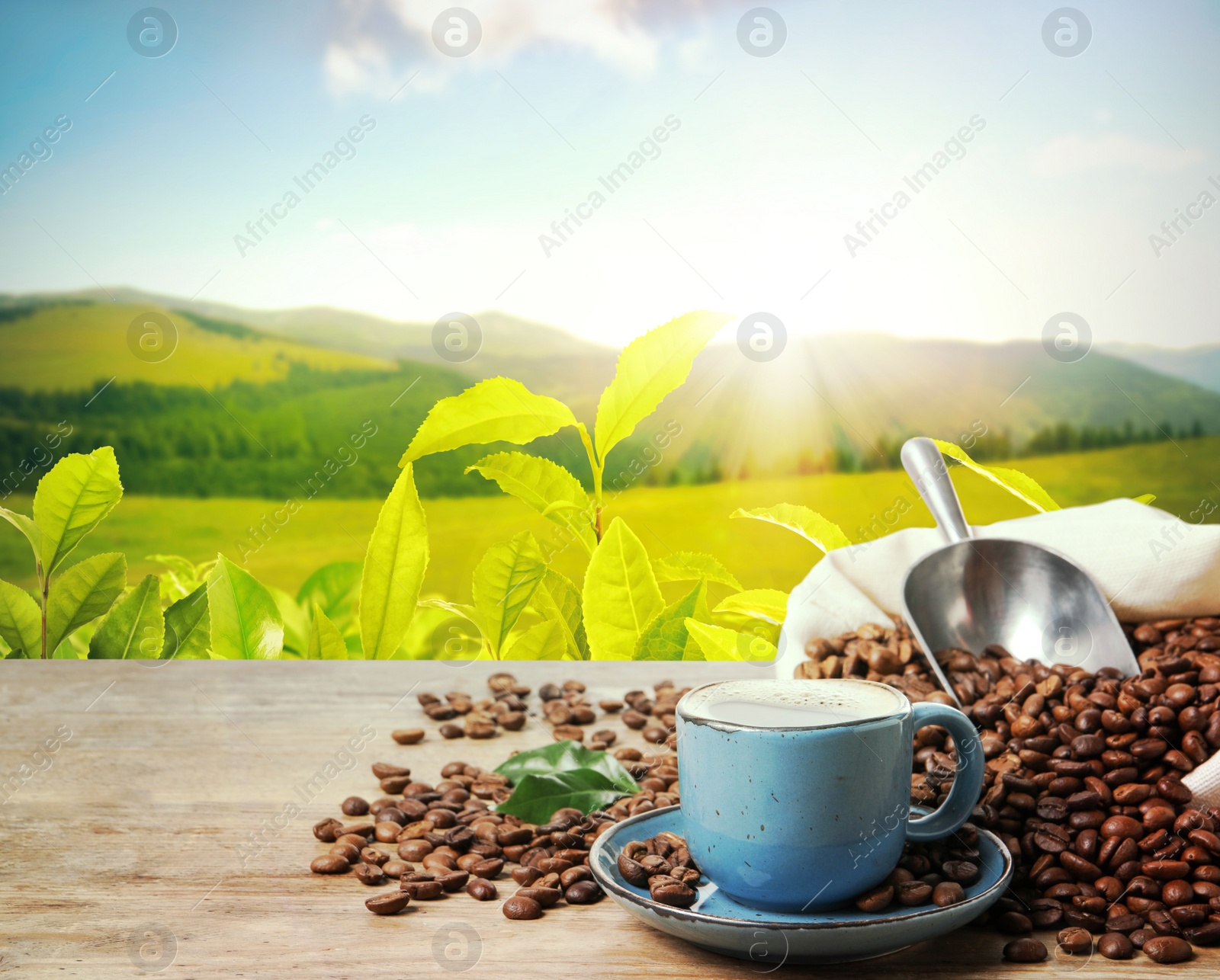 Image of Cup of aromatic hot coffee and beans on wooden table outdoors. Space for text