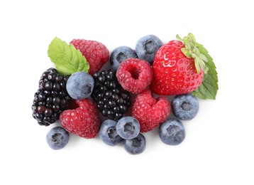 Photo of Many different ripe berries and mint leaves isolated on white, top view