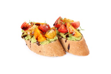 Photo of Delicious bruschettas with avocado, tomatoes and balsamic vinegar isolated on white