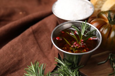 Photo of Tasty marinade and products on wooden table, closeup