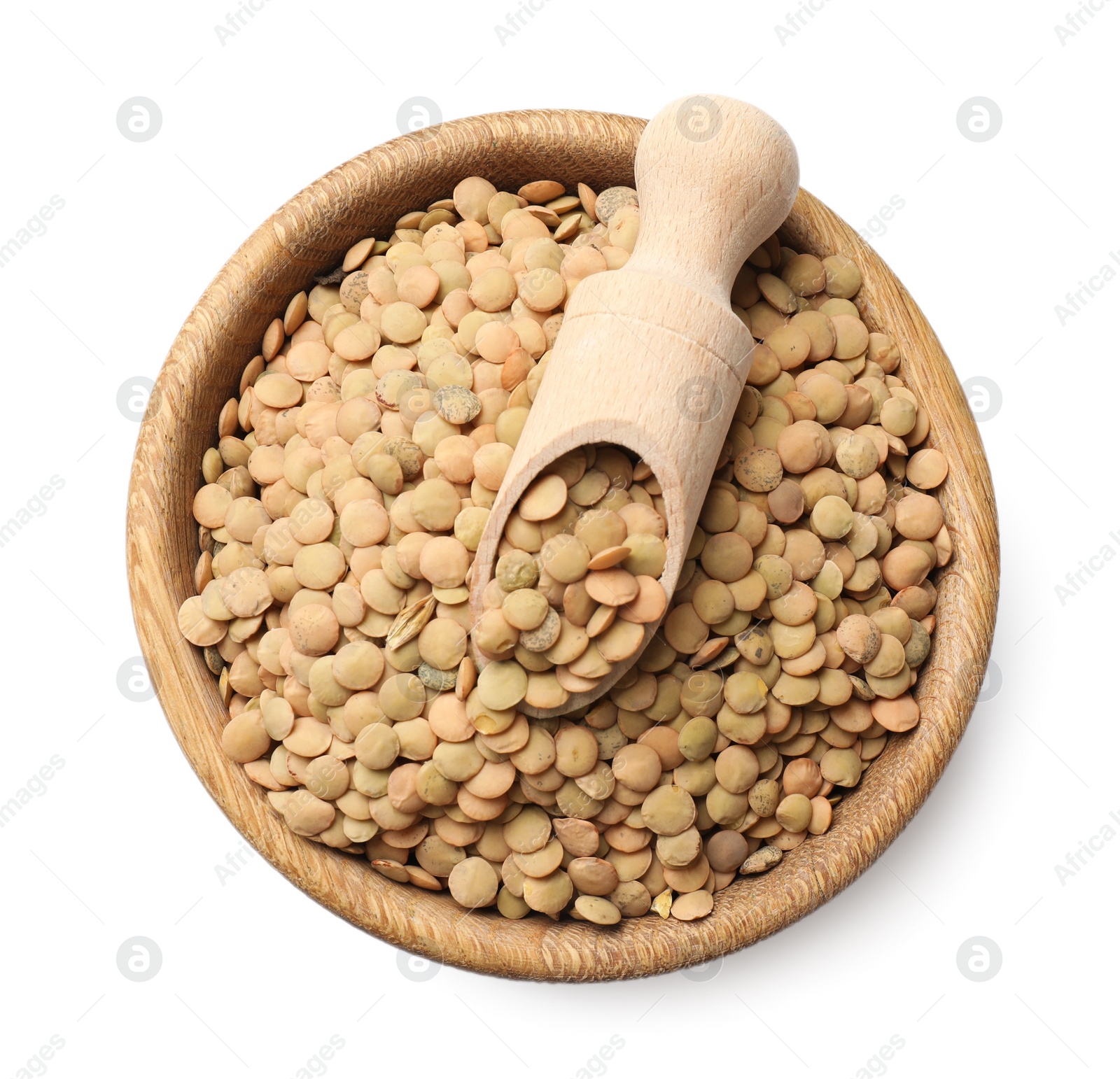 Photo of Raw lentils and scoop in bowl isolated on white, top view