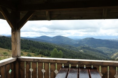 Photo of Picturesque view of mountain landscape from wooden gazebo