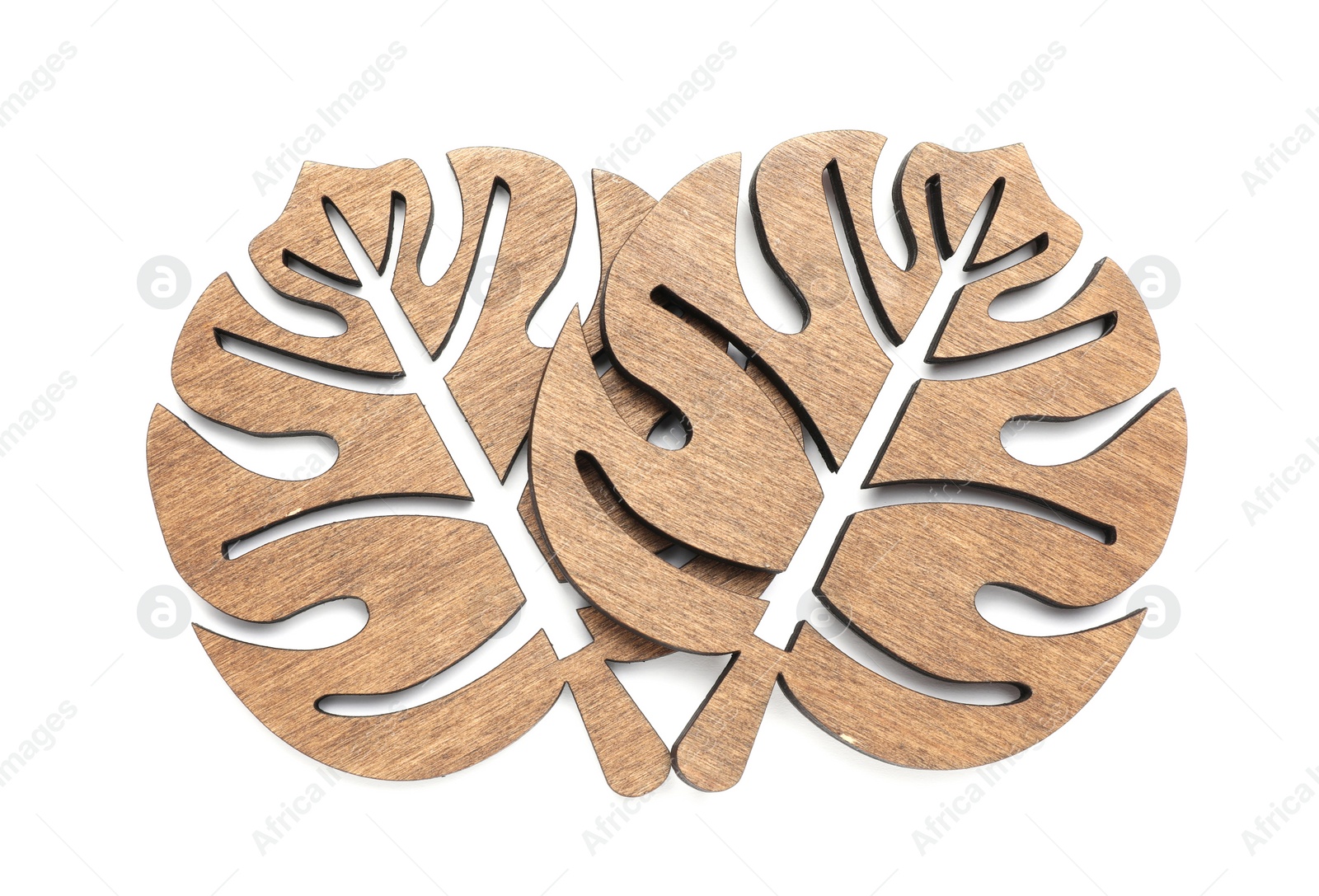 Photo of Leaf shaped wooden cup coasters on white background, top view