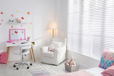 Photo of Modern child room interior with stylish furniture