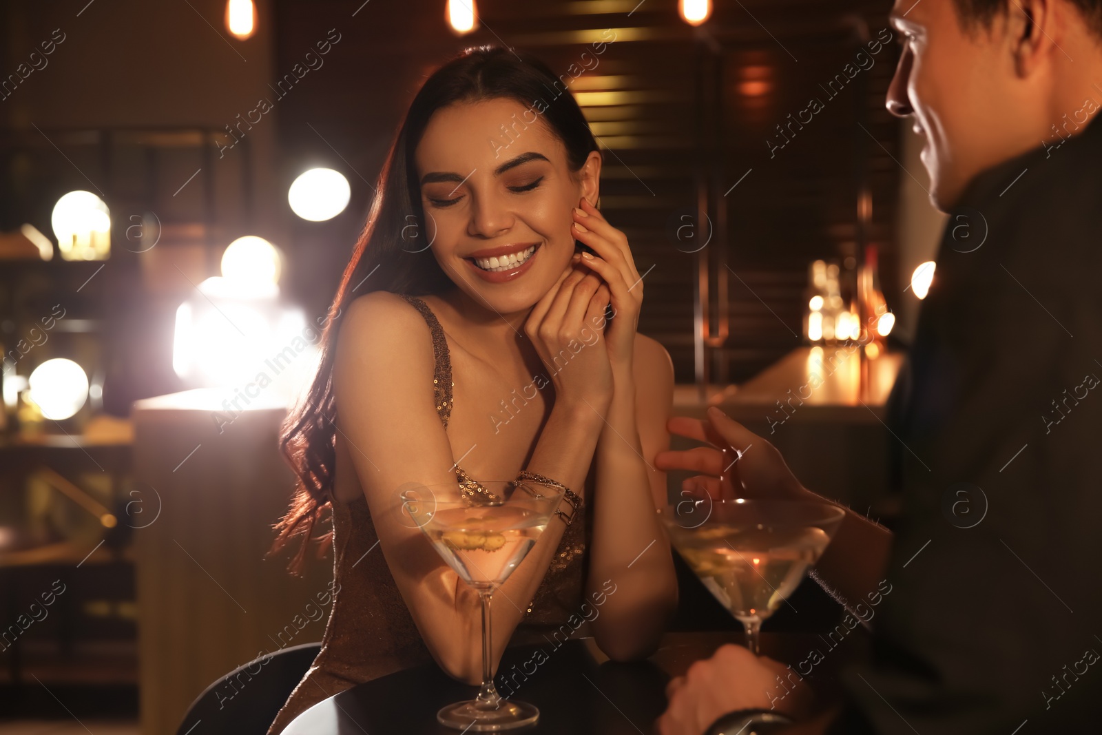 Photo of Man and woman flirting with each other in bar