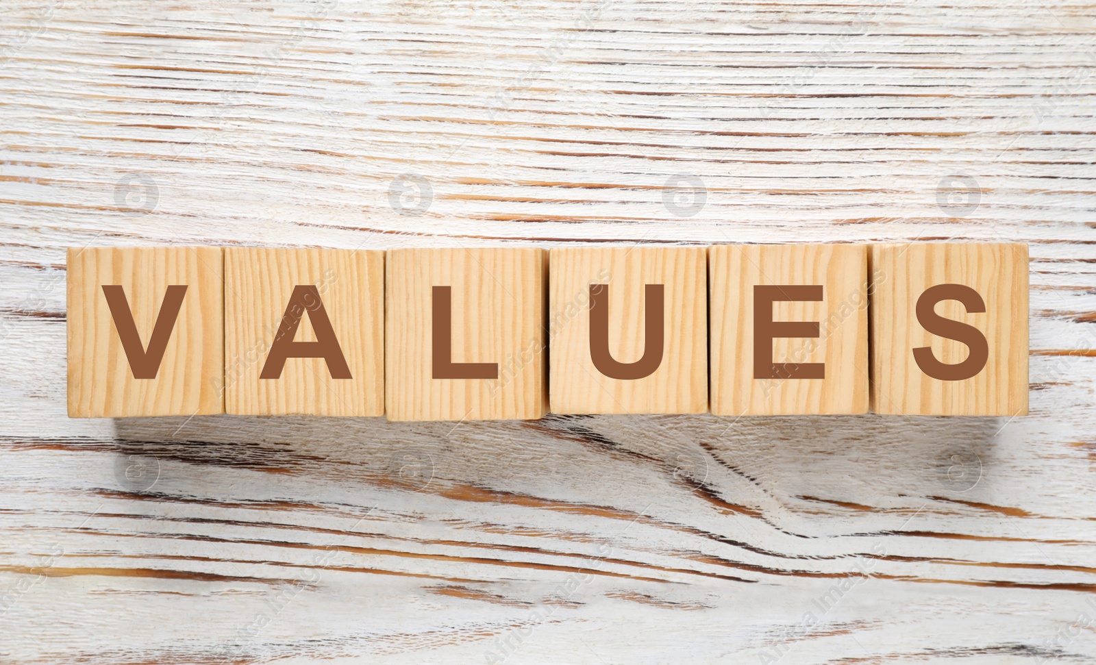 Photo of Cubes with word VALUES on white wooden background, flat lay